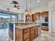 Island kitchen features granite countertops, stainless steel appliances, and breakfast bar at 3220 W Feather Sound Dr, Anthem, AZ 85086