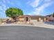 Beautiful home exterior with three-car garage and landscaping at 3220 W Feather Sound Dr, Anthem, AZ 85086
