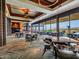 Elegant dining room with large windows and a wine display at 3220 W Feather Sound Dr, Anthem, AZ 85086