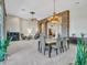 Spacious dining area with a large table and stone accents at 3220 W Feather Sound Dr, Anthem, AZ 85086