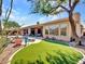 Artificial turf backyard with pool and mountain views at 3220 W Feather Sound Dr, Anthem, AZ 85086