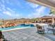 Resort-style backyard oasis featuring a sparkling pool and spa at 3220 W Feather Sound Dr, Anthem, AZ 85086