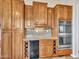 Kitchen features double ovens, wine rack, and ample wood cabinets at 3220 W Feather Sound Dr, Anthem, AZ 85086