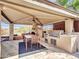 Outdoor kitchen with built-in grill, sink, and seating area at 3220 W Feather Sound Dr, Anthem, AZ 85086