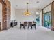 Bright dining room with large windows and mountain views at 3220 W Feather Sound Dr, Anthem, AZ 85086