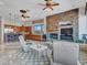 Open living area with stone fireplace and kitchen views at 3220 W Feather Sound Dr, Anthem, AZ 85086
