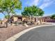 Beautiful tan house with desert landscaping and a long driveway at 3220 W Feather Sound Dr, Anthem, AZ 85086