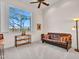 Relaxing office space with a sofa and large window at 3220 W Feather Sound Dr, Anthem, AZ 85086