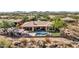 Aerial view of house with pool and mountain views at 3220 W Feather Sound Dr, Anthem, AZ 85086