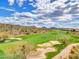 Aerial view of a beautiful golf course with desert landscape at 3220 W Feather Sound Dr, Anthem, AZ 85086