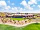 Aerial view of a luxurious clubhouse with a green lawn at 3220 W Feather Sound Dr, Anthem, AZ 85086