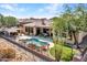 Aerial view of house, pool, and backyard at 3220 W Feather Sound Dr, Anthem, AZ 85086