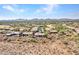 Aerial view of a luxury community with mountain views and desert landscape at 3220 W Feather Sound Dr, Anthem, AZ 85086