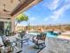 Relaxing patio area overlooking the pool and landscape at 3220 W Feather Sound Dr, Anthem, AZ 85086