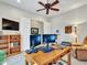 Home office with built-in shelving and dual monitors at 3220 W Feather Sound Dr, Anthem, AZ 85086