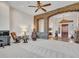 Open living room with stone accents and views of the backyard at 3220 W Feather Sound Dr, Anthem, AZ 85086