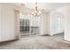 Bright dining room with chandelier and sliding glass doors to balcony at 2794 S Alpine Dr, Gilbert, AZ 85295