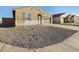 Landscaped front yard with gravel and drought-tolerant plants at 37296 W Patterson St, Maricopa, AZ 85138