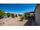 Landscaped backyard with patio furniture and desert landscaping at 215 N Power Rd # 158, Mesa, AZ 85205