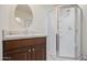 Bathroom with granite countertop, dark wood cabinets and shower at 12030 N 36Th St, Phoenix, AZ 85028