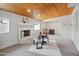 Cozy living room features a stone fireplace and wood-beamed ceiling at 12030 N 36Th St, Phoenix, AZ 85028