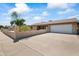 House exterior with a white garage door and landscaping at 12030 N 36Th St, Phoenix, AZ 85028
