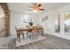 Bright dining area with wooden table and access to backyard at 12030 N 36Th St, Phoenix, AZ 85028