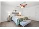 Bright bedroom with ceiling fan, neutral decor, and ample closet space at 12030 N 36Th St, Phoenix, AZ 85028