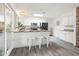 Modern kitchen with white cabinets, granite countertops, and island at 12030 N 36Th St, Phoenix, AZ 85028