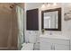 Clean bathroom with shower, toilet and vanity with updated fixtures at 12030 N 36Th St, Phoenix, AZ 85028