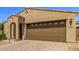 House exterior featuring a large two-car garage and a paved driveway at 7930 W Pasadena Ave, Glendale, AZ 85303