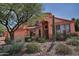 Two-story home with a three-car garage and desert landscaping at 4055 N Recker Rd # 71, Mesa, AZ 85215