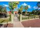 Community entrance with lush landscaping and gated access at 4615 N 39Th Ave # 27, Phoenix, AZ 85019