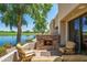 Relaxing patio with fireplace and lake view at 8989 N Gainey Center Dr # 114, Scottsdale, AZ 85258