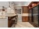 Kitchen features wine coolers and custom cabinetry at 8989 N Gainey Center Dr # 114, Scottsdale, AZ 85258