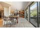 Kitchen with granite countertop breakfast bar, offering views of the living area and patio at 8989 N Gainey Center Dr # 114, Scottsdale, AZ 85258