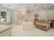 Luxurious bathroom with soaking tub, glass shower, and chaise lounge at 8989 N Gainey Center Dr # 114, Scottsdale, AZ 85258
