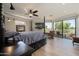 Spacious main bedroom with large windows, golf course view, and ensuite bathroom at 8989 N Gainey Center Dr # 114, Scottsdale, AZ 85258