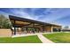 Relaxing outdoor patio area with seating and a bar at 8989 N Gainey Center Dr # 114, Scottsdale, AZ 85258