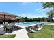 Inviting pool area with lounge chairs, tables, and umbrellas at 8989 N Gainey Center Dr # 114, Scottsdale, AZ 85258
