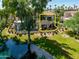 Aerial view of a two-story home near a lake at 8989 N Gainey Center Dr # 114, Scottsdale, AZ 85258