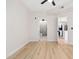 Bedroom with bathroom and kitchen access. Features light wood flooring at 18416 N Cave Creek Rd # 2037, Phoenix, AZ 85032