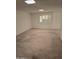 Spacious living room with a skylight and window at 10617 W Deanne Dr, Sun City, AZ 85351
