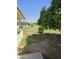 Landscaped backyard with mature trees and grass at 10617 W Deanne Dr, Sun City, AZ 85351