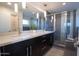 Modern bathroom with double vanity, large shower, and contemporary finishes at 8744 E Arlington Rd, Scottsdale, AZ 85250