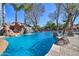 Stunning pool with a waterfall and rock features at 6614 W Sweetwater Ave, Glendale, AZ 85304