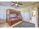 Bedroom with a wooden bunk bed and ample closet space at 6614 W Sweetwater Ave, Glendale, AZ 85304