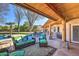 Relaxing patio area with seating and a view of the pool at 6614 W Sweetwater Ave, Glendale, AZ 85304