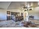Spacious main bedroom with a large bed, ample floor space, and ensuite access at 6614 W Sweetwater Ave, Glendale, AZ 85304