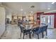 Open dining area with a large, rustic wood table at 6614 W Sweetwater Ave, Glendale, AZ 85304